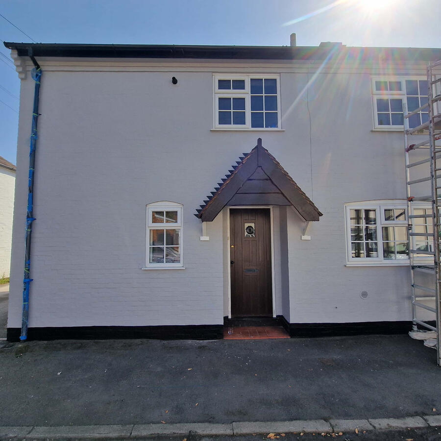 Masonry, soffits entrance and tilework painted